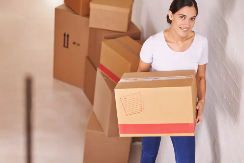 Resident unpacking cartons after moving into a new Dubai home